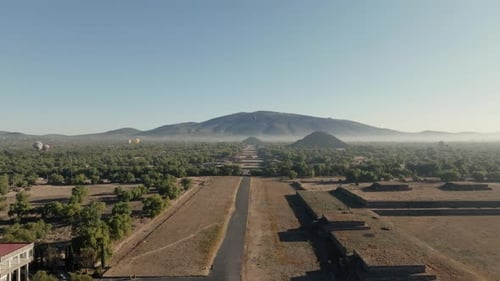 Cinematic Shot Of Teotihuacan City of Gods, Aztec Pyramids, Hot Air Balloons Flying Peacefully,