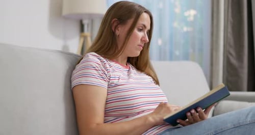 Woman Reading Book at Home