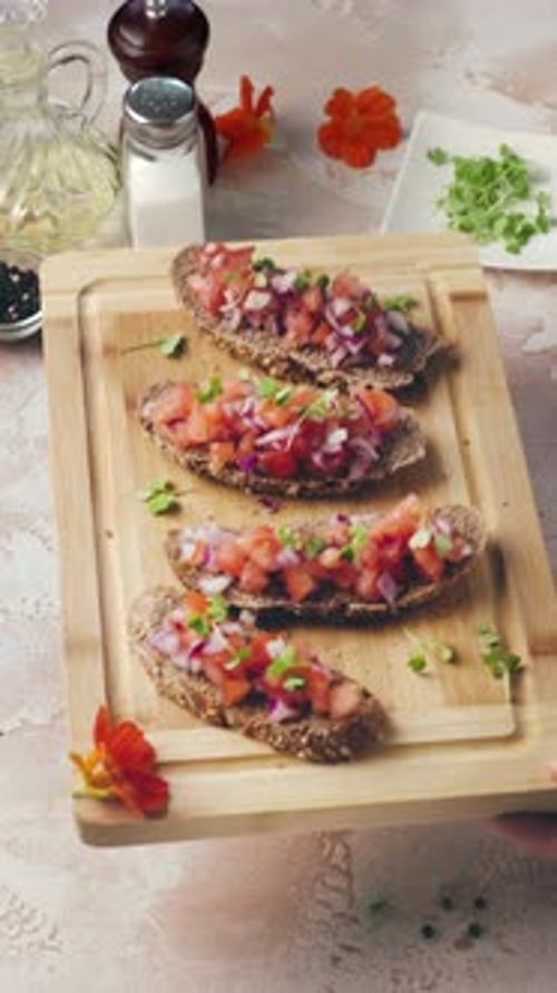 Preparing Four Bruschetta With Tomato and Onion