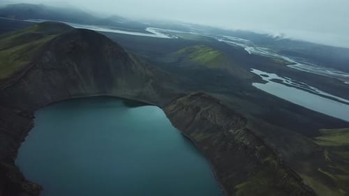 Volcanic and Glacial Landscape of Iceland. Aerial View of Lake in Volcanic Crater and Fog Over Mount