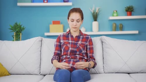 Young woman experiencing sudden movement dizziness.