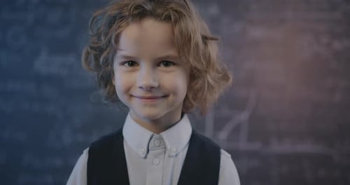 Cute Child Smiling in School Classroom Portrait