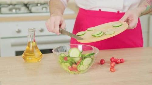 Preparing Fresh Green Salad in Bright Kitchen