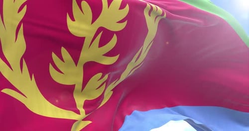 Eritrea Flag Waving Against a Clear Blue Sky