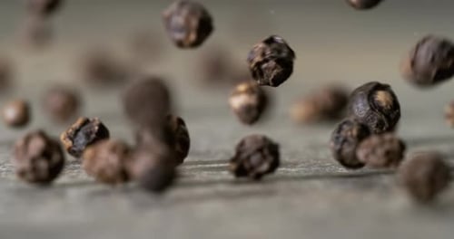 Peppercorns or black pepper spice. Super Macro Close Up. Shot on super slow motion camera 1000 fps.