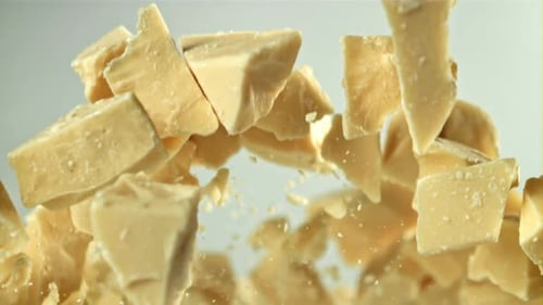 Pieces of White Chocolate Fly Up and Fall Down Filmed on a Highspeed Camera at 1000 Fps