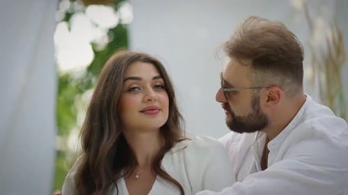 Loving Couple Embrace During an Outdoor Wedding