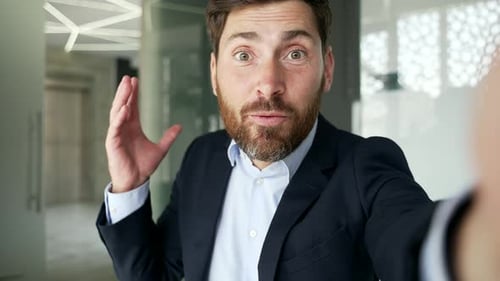 Friendly Business Man Video Call in Modern Office