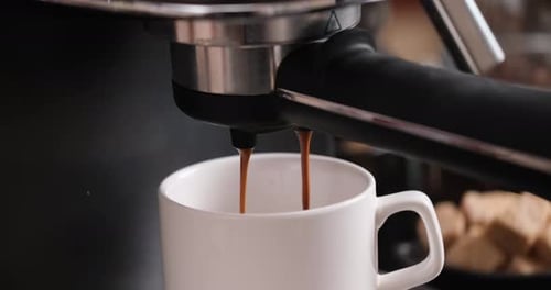 HomeEspresso Making Pouring Coffee Stream From Machine Into Cup