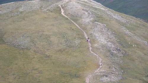 Group of people hiking on tundra at high altitude
