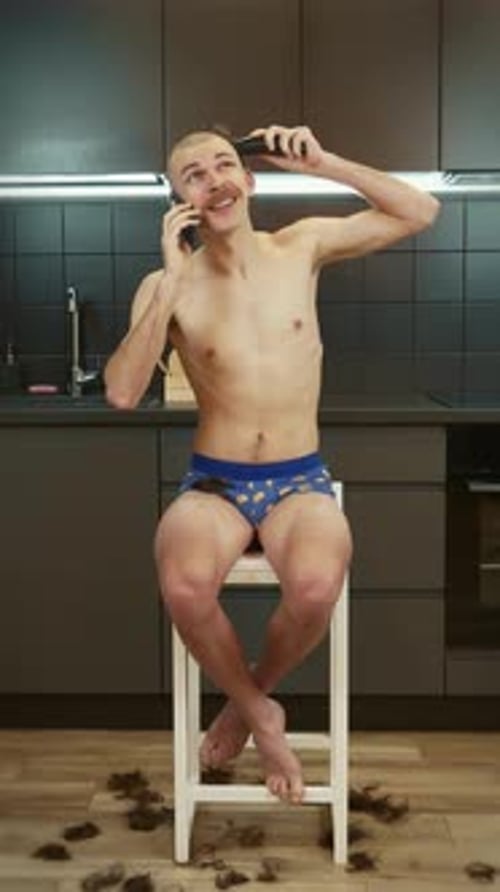 Man Gives Himself Haircut While Talking on Phone