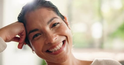 Smiling Woman with Dark Hair Relaxing at Home