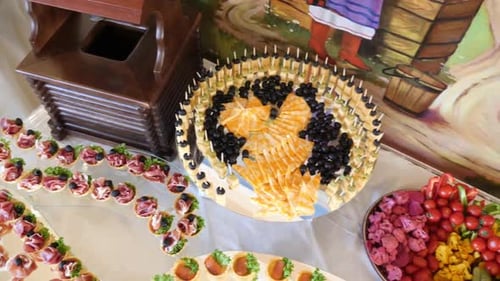 F199. Festive buffet with sausages and greens.