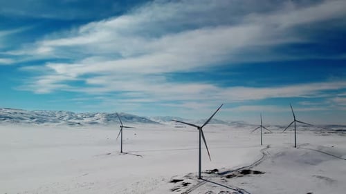 Wind Turbine On Winter Snowy Field