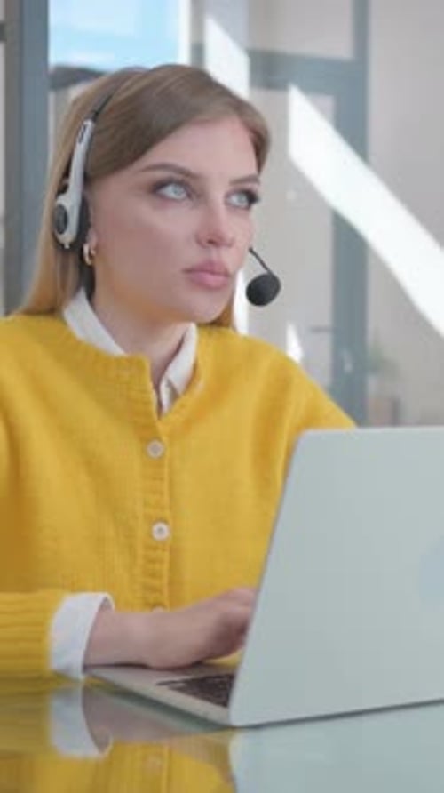 Call Center Woman with Headset Talking Online with Customer, vertical video