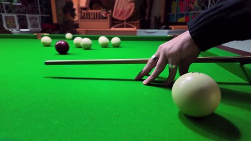 Billiards in Motion: Spinning Ball Adds Excitement to the Game. Billiards game in progress. See the