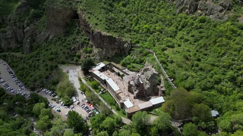 4K drone video of Geghard Monastery UNESCO World Heritage in Armenia. Zoom out shot from above. The