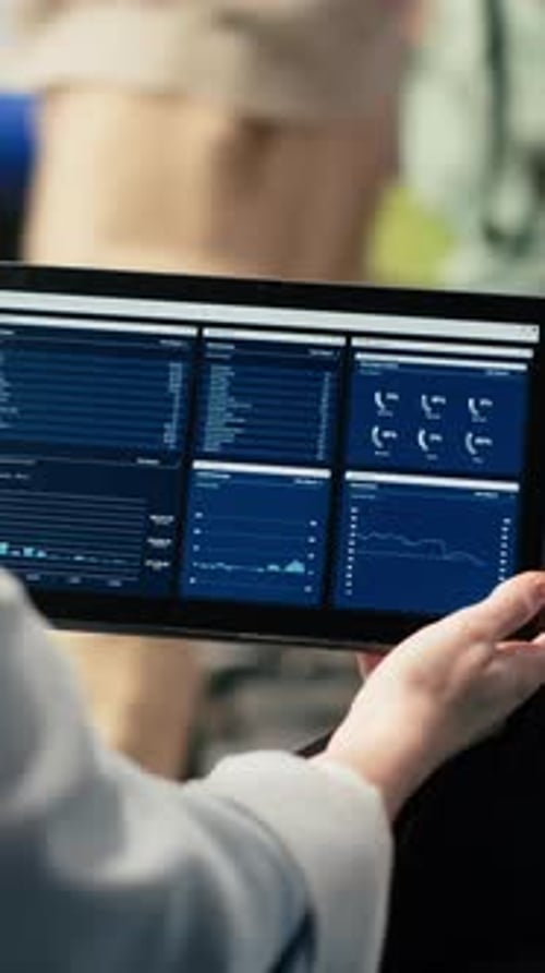 Vertical Video Remote Accountant Reviewing Reports and Data Charts on Laptop in Airport