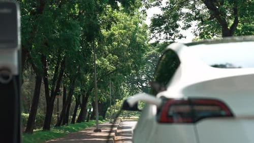EV electric vehicle recharging battery in national park. Exalt
