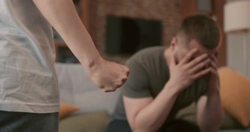 Tense Indoor Conflict Between Two Adults