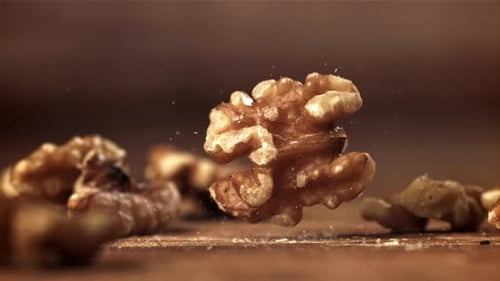 Falling Walnuts in Slow Motion on Wood