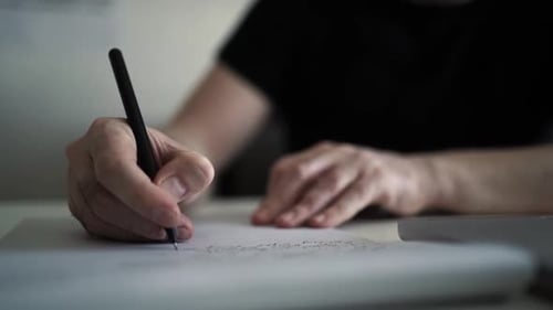 Creative Journaling: Man Working from Home Office