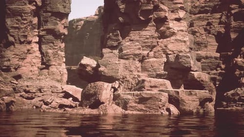 the River Flowing Through the Valley of Huge Red Rocks