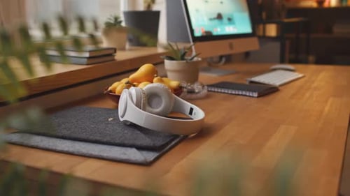 Desk with headphones and a computer