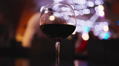 Wine Glass Filled With Red Wine at Night