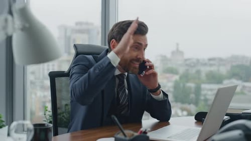 Stressed boss quarreling on phone in modern office closeup feeling anger
