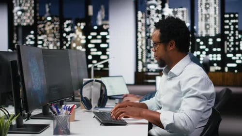 Tech Startup IT Specialist Developing AI Algorithms in Office Listening Music