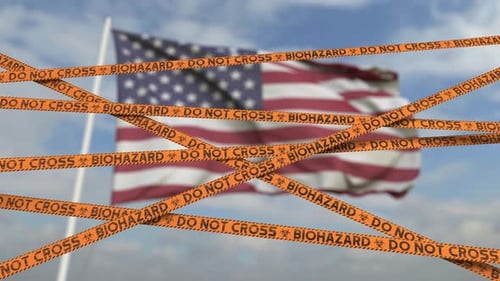 Líneas de cinta de restricción de riesgos biológicos contra la bandera estadounidense