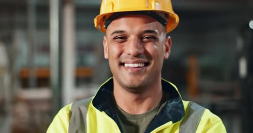 Smiling Construction Worker with Hard Hat in Factory