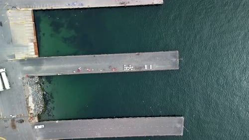 Empty docks of sea marina with no boats on the anchor