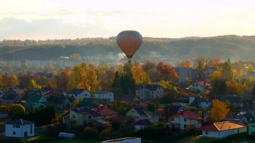 Idyllic View Of A Flying Hot Air Balloon During Autumn At Sunset In Vilnius, Lithuania. Aerial Shot