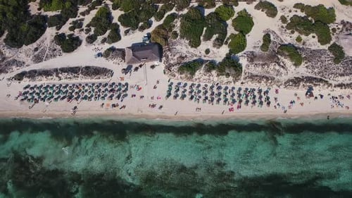 Drone footage of tourists at the beach in Spain, Balearic Islands - Es Trenc Majorca / Mallorca