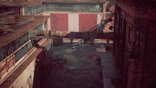 Abandoned Factory in Ruins Surrounded By Decaying Brick Structures