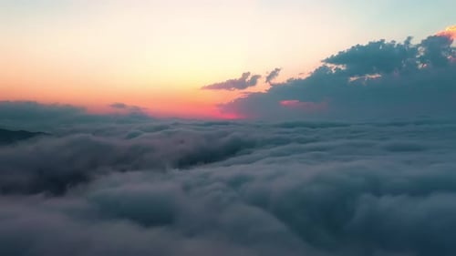 Aerial View Above the Clouds at Sunset