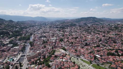 Aerial: Sarajevo cityscape with river and hills Bosnia and Herzegovina