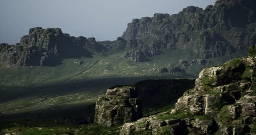 Majestic Rocky Mountains with Lush Greenery and Subtle Shadows at Dusk