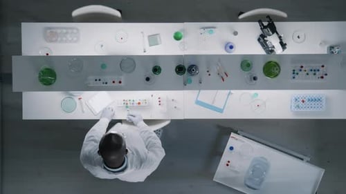 Chemist Working with Samples in Test Tubes