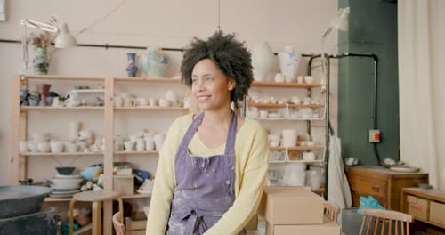 Portrait of Woman in Pottery Studio, Looking at camera