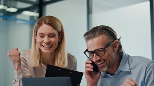 Overjoyed Businesspeople Rejoicing Modern Office