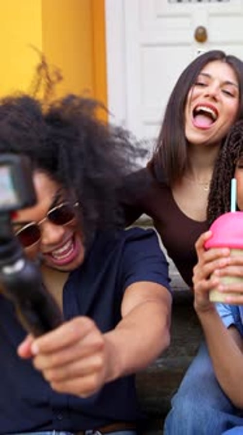 Friends Posing Together in Front of Building