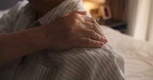 Old Woman Suffering From Neck An Older Woman Massages the Muscles of Her Shoulder and Neck An Older