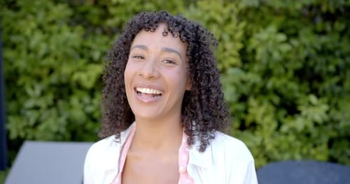 Woman Smiling Toward Camera Outdoors