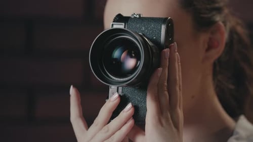 Woman Posing with a Camera Close-up Shot