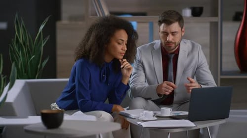 Business Couple Working Laptop Computer at Modern Workplace Office. Young Business People