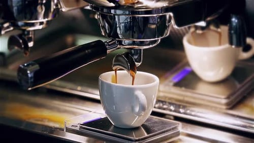 Espresso Machine Pours Rich Coffee into Cup
