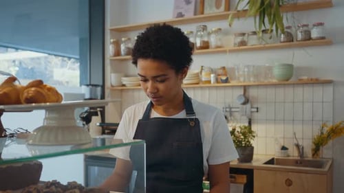 employees working in a nordic styled cafe.